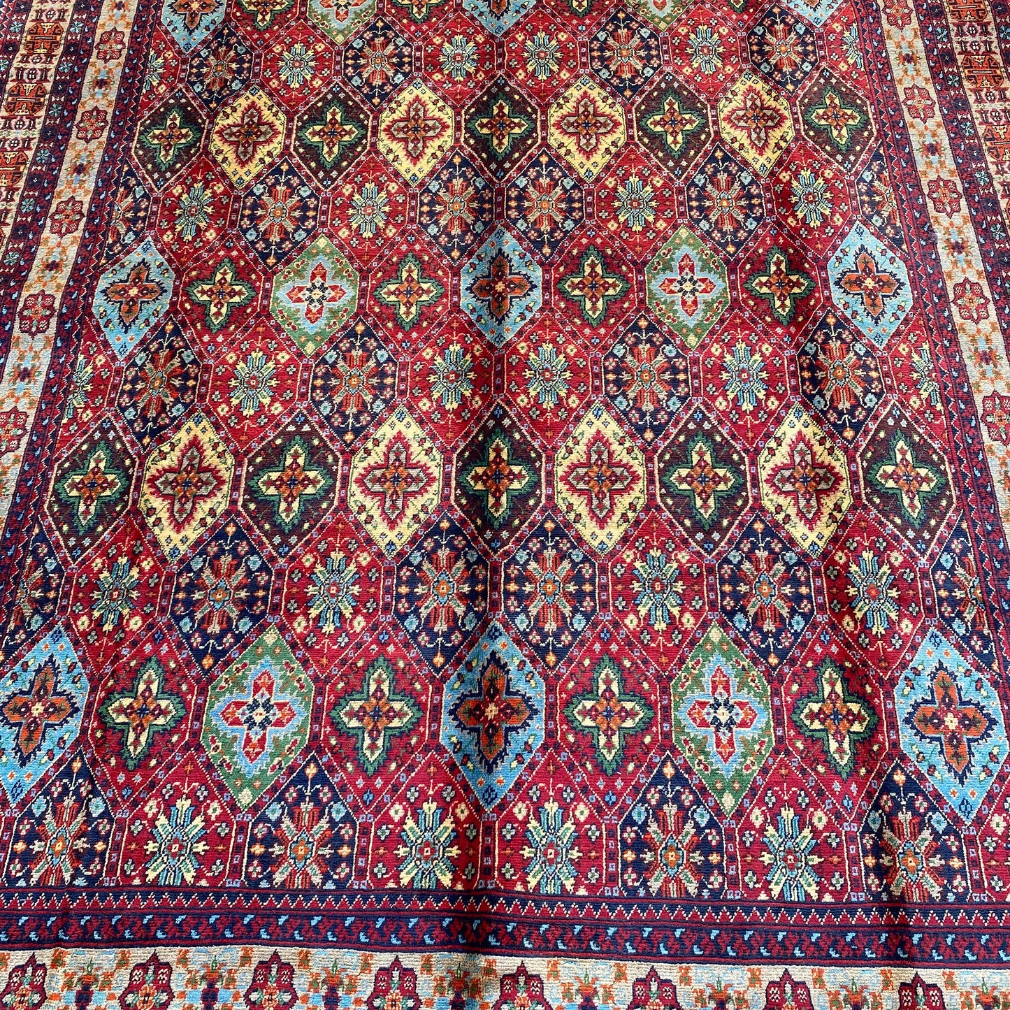 Handwoven Marinos Kashi Gul Rug with Vibrant Colors and Geometric Motifs