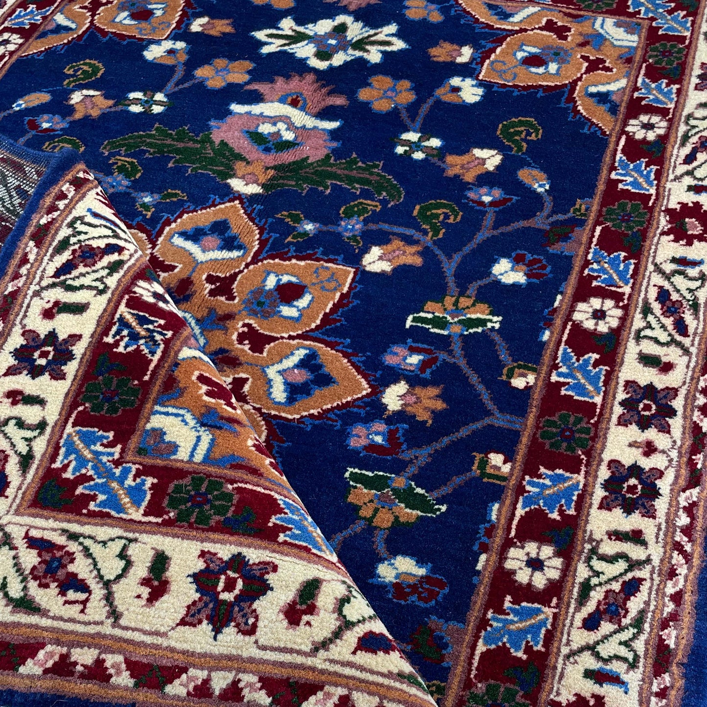 Handwoven Marinos Rug with Floral Motifs and Vibrant Colors