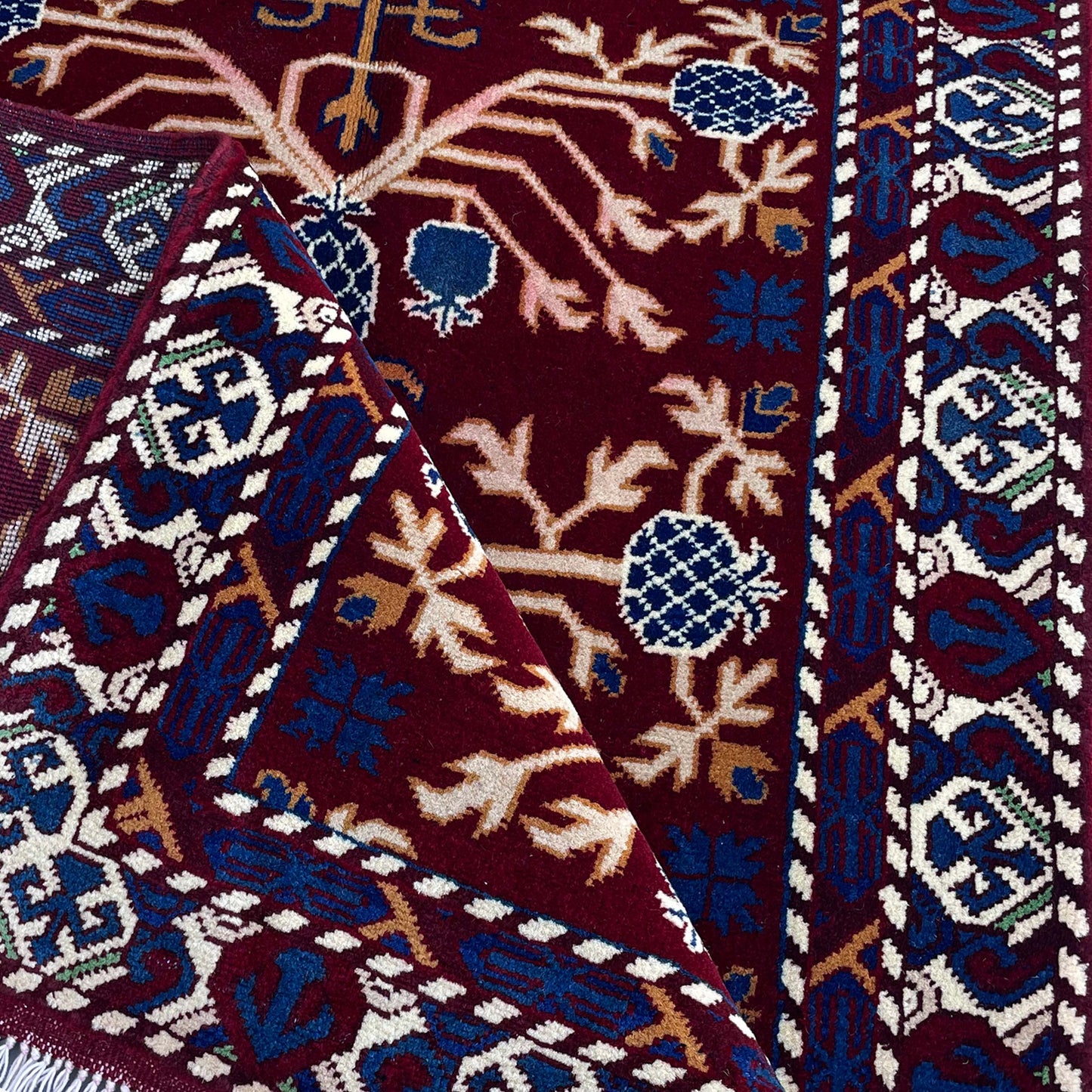 Marinos Anar Gul Rug – Afghan Craftsmanship in Deep Crimson with Symbolic Blossoms