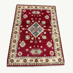Ruby Field Afghan Kazak Rug – Hand-Knotted Geometric Medallion & Floral Motifs