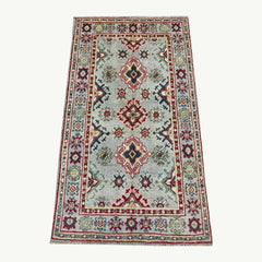 Grey-Field Afghan Kazak Rug – Medallion & Star Border Motifs