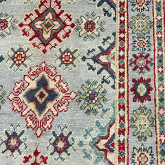 Grey-Field Afghan Kazak Rug – Medallion & Star Border Motifs