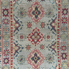 Grey-Field Afghan Kazak Rug – Medallion & Star Border Motifs