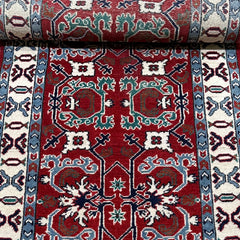 Afghan Kazak 9.7 x 2.6 Runner – Rich Red Field with Tribal Geometric Motifs