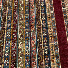 Shaal 9.7 x 6.6 Wool Rug – Tribal Stripe Symphony in Ruby & Earth Tones